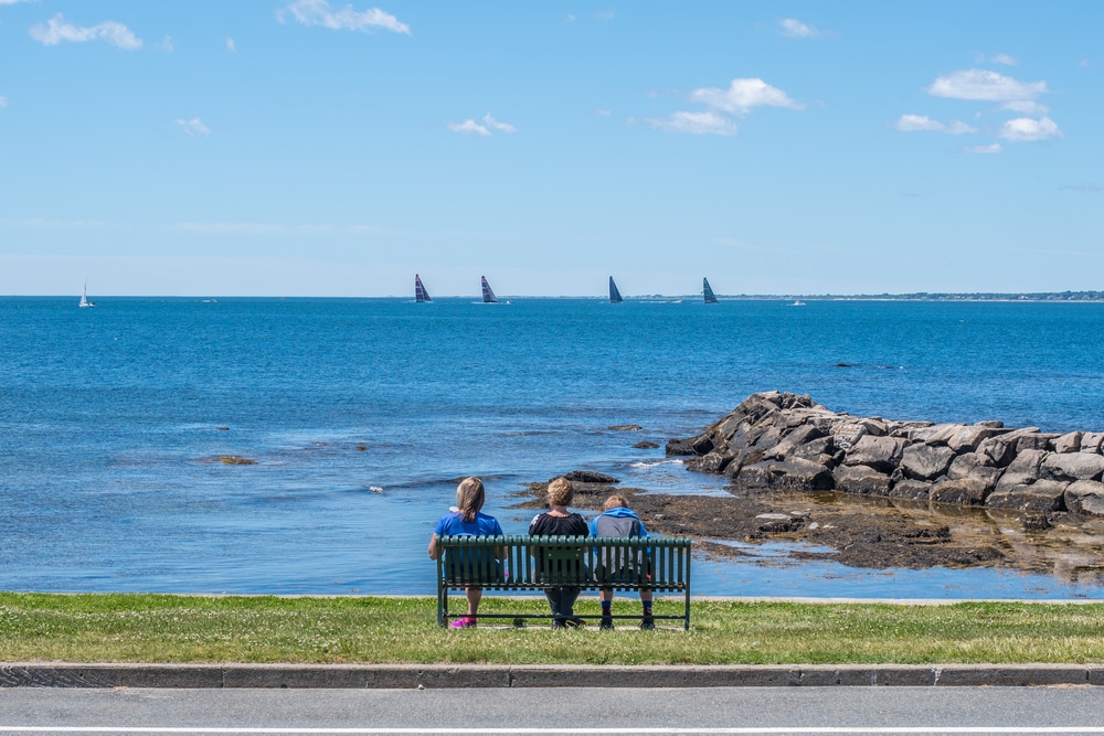 People enjoying the view of Narragansett Bay from Brenton Point State Park