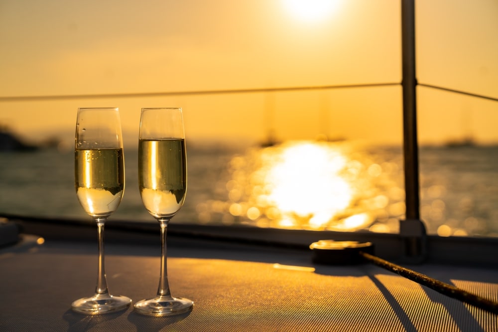Two glasses of champagne at sunset during a dinner cruise in Newport, RI