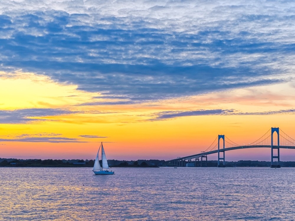 Sunset over Narragansett Bay, which you can experience on a dinner cruise in Newport, RI or Newport RI Sailing Charters